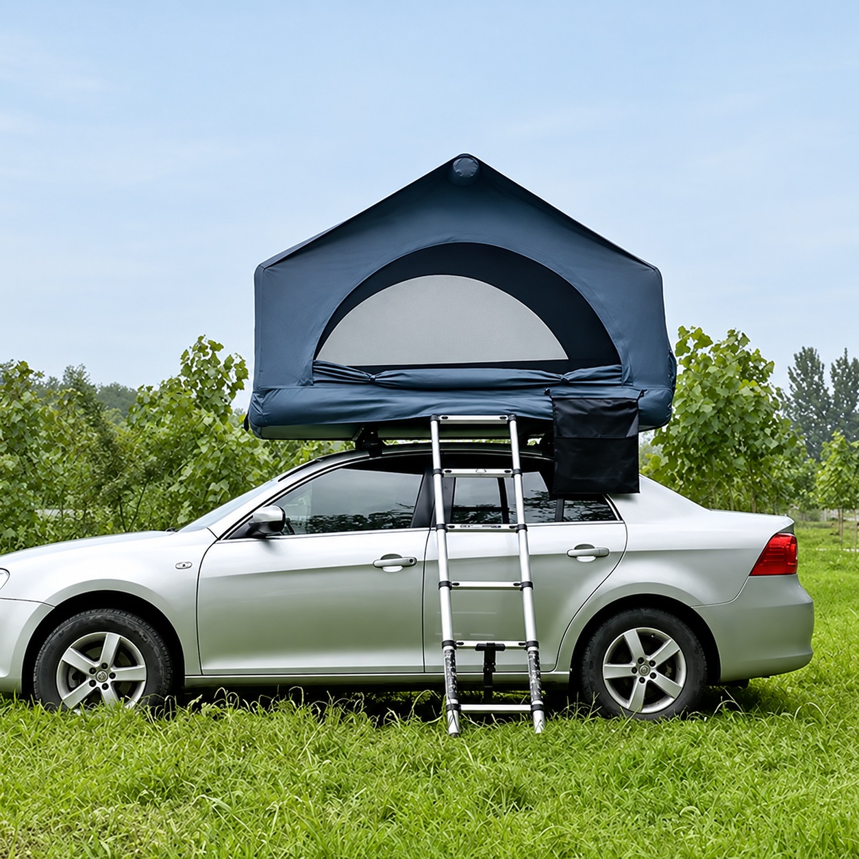 Dark peaked rooftop tent with an arched front opening and an extended ladder above a parked vehicle.