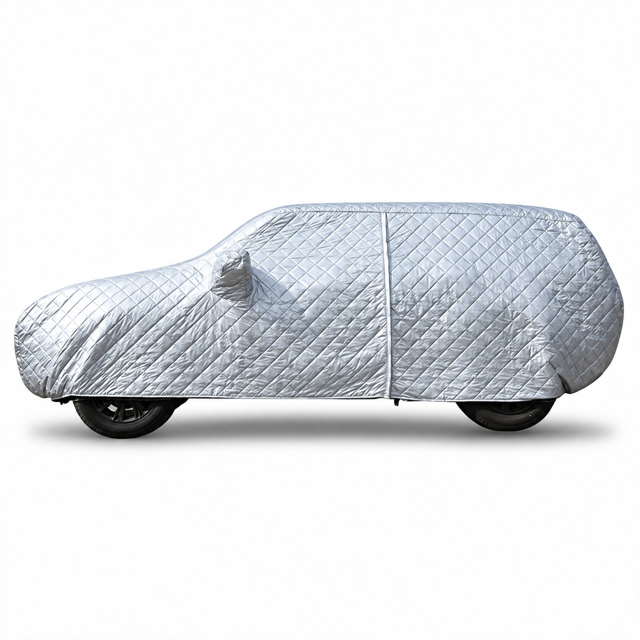 Side view of a silver quilted padded car cover showing panel seams and lower hem