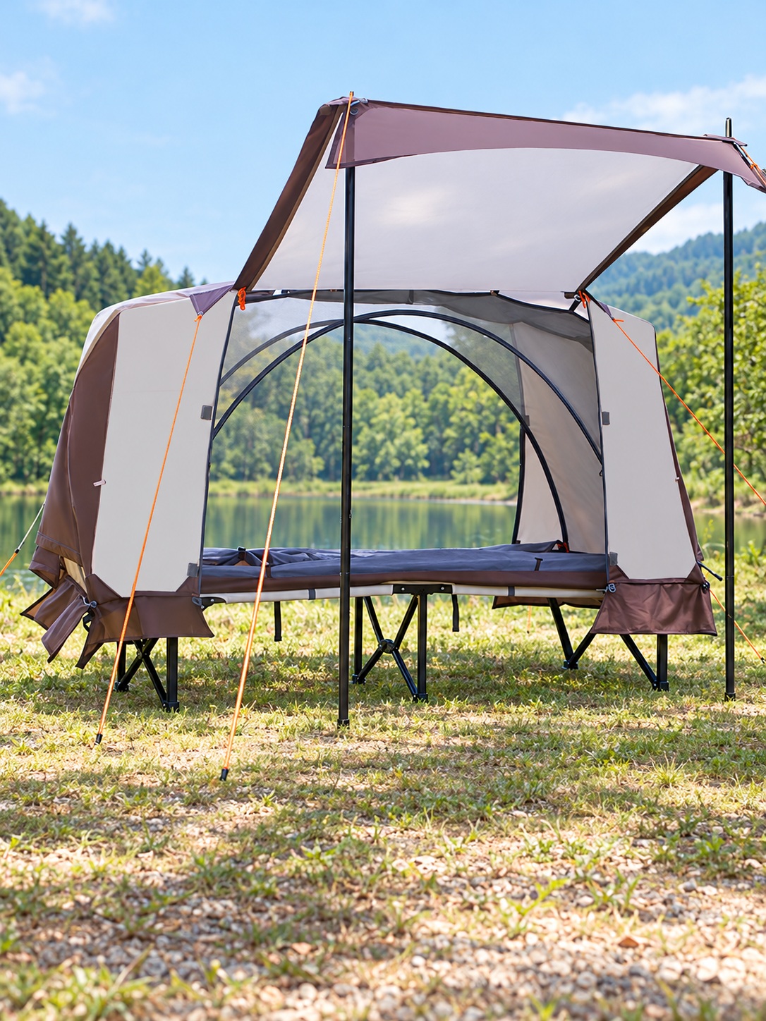 Narrow mesh sleeping tent on a raised camp cot with an extended front awning.