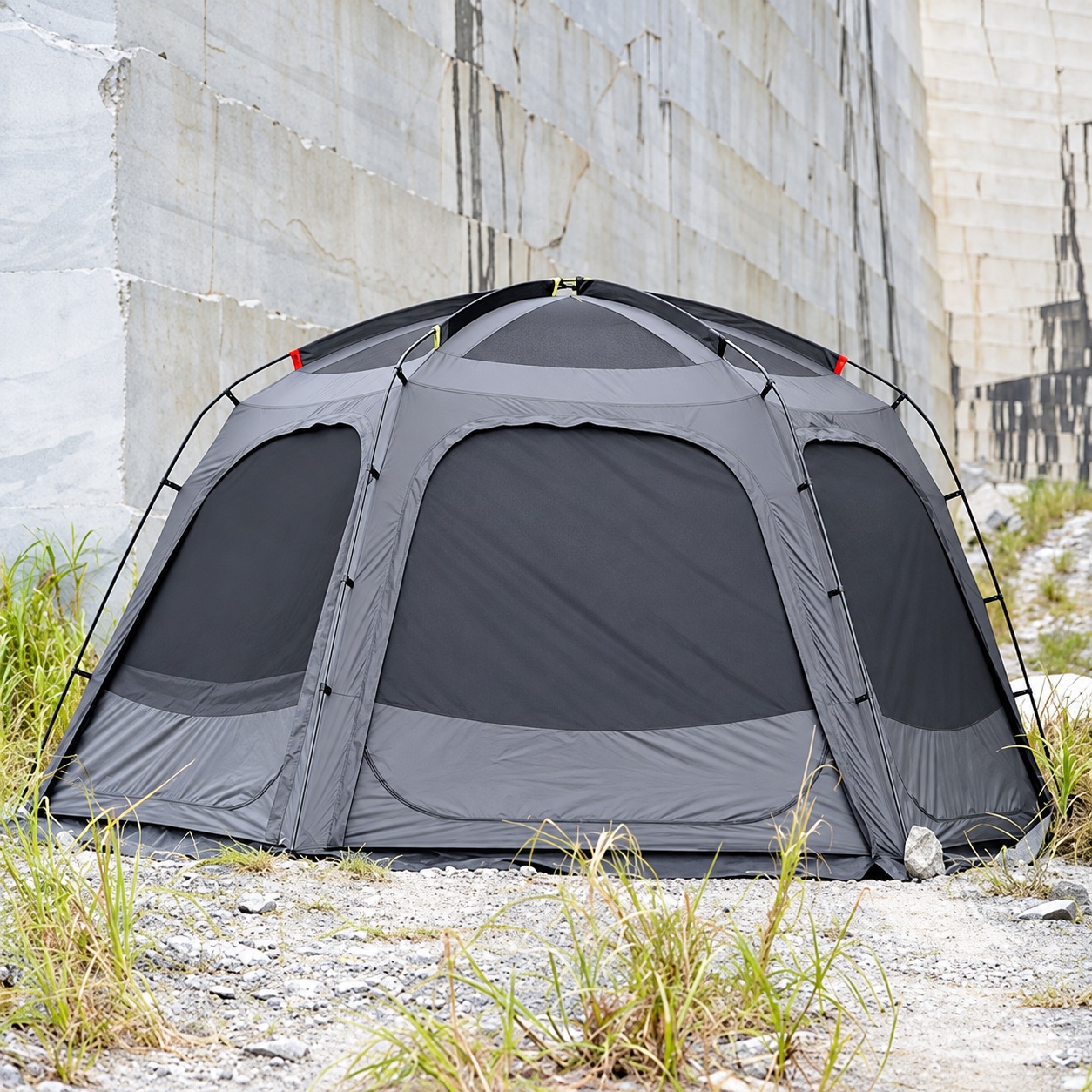 Gray dome shelter with closed wall panels, curved exterior poles and a roof viewing panel