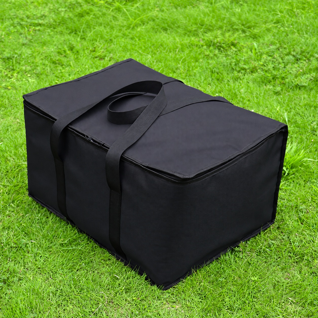 Black rectangular camping cookware case with a zippered lid and webbing carry handles.